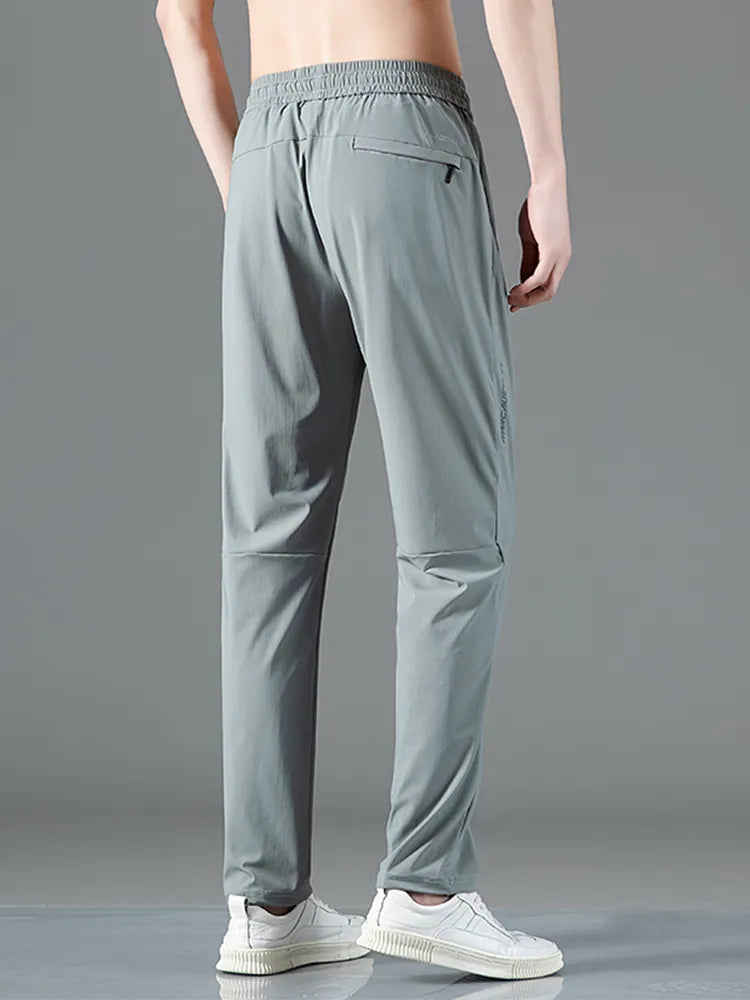 Pantalon de survêtement de sport extensible avec poches zippées pour hommes