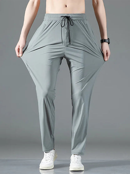 Pantalon de survêtement de sport extensible avec poches zippées pour hommes